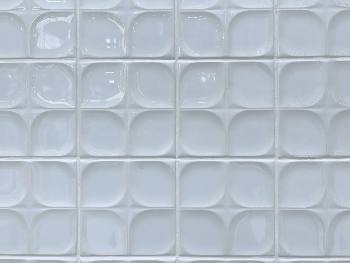 home improvement porcelain tile pro con showing cracked tile next to pristine sample